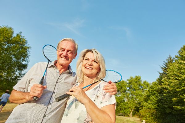 Happy-Senior-Couple-Playing-Badminton.