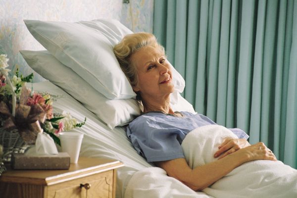 <br />
Senior-woman-in-hospital-bed